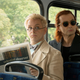 The angel Aziraphale reads the paper as the demon Crowley stares at a fellow passenger on the bus.